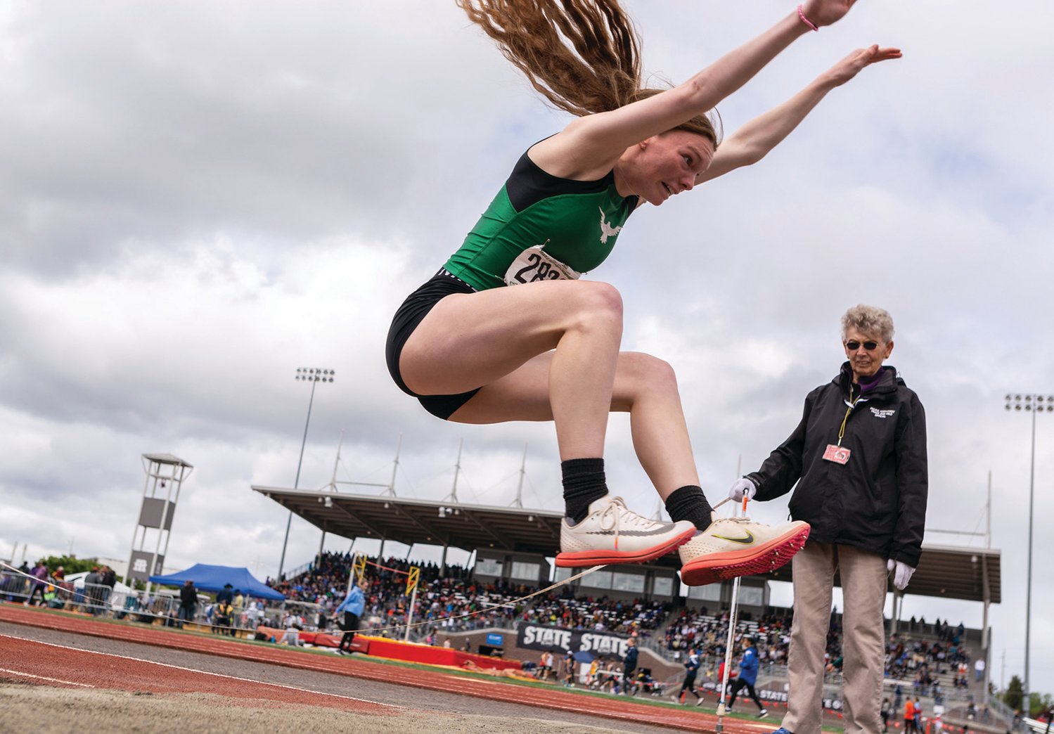 Tumwater's Alyssa Duncan flies through the air in the 2A Girls Long Jump at the 4A/3A/2A State Track and Field Championships on Friday, May 27, 2022, at Mount Tahoma High School in Tacoma. (Joshua Hart/For The Chronicle)